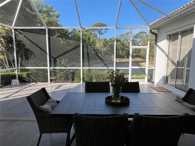 SCREENED OUTDOOR DINING SPACE.