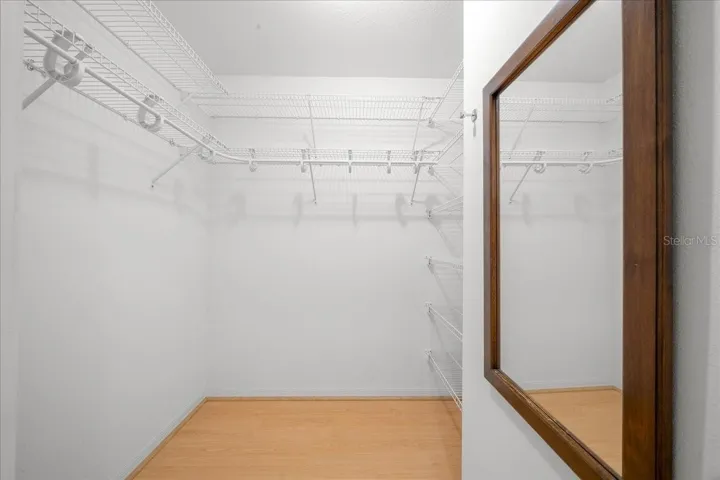 Primary Bedroom Walk in closet 1 of 2