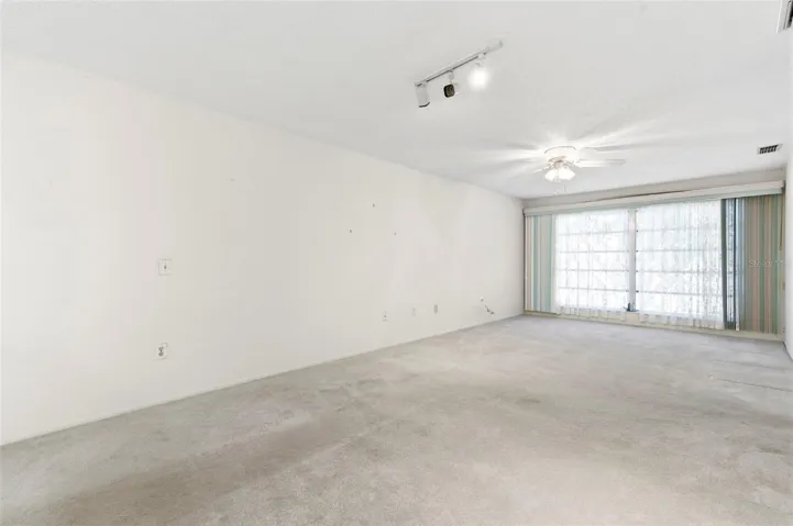 Ceiling fans throughout the home circulate cool breezes.