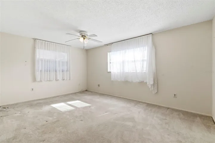 Natural light shines into the second bedroom.