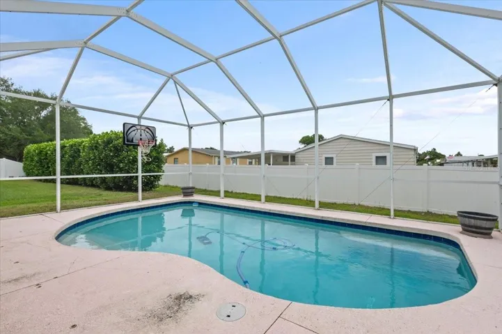 Relax in the screened backyard pool!