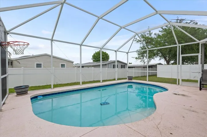 Relax in the screened backyard pool!
