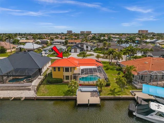 Aerial View of the back including dock, pool and lanai
