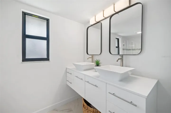 Main floor primary bath with dual sinks