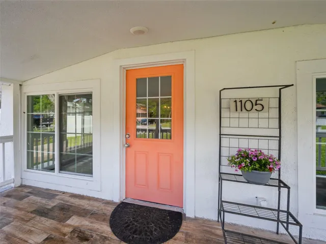 Covered front porch creates a warm and welcoming entrance to the home.