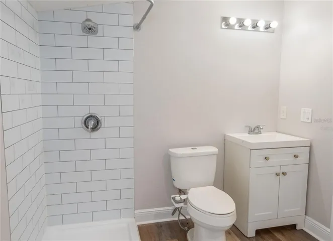 Updated bathroom featuring a modern subway tile shower and clean contemporary finishes.