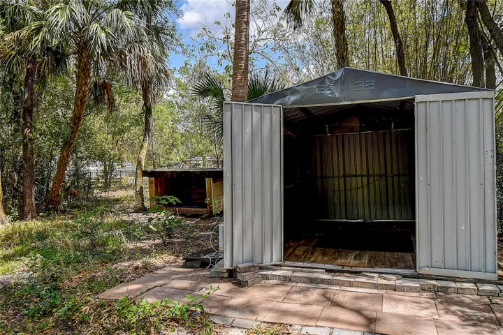Dog house on left, and storage shed on right