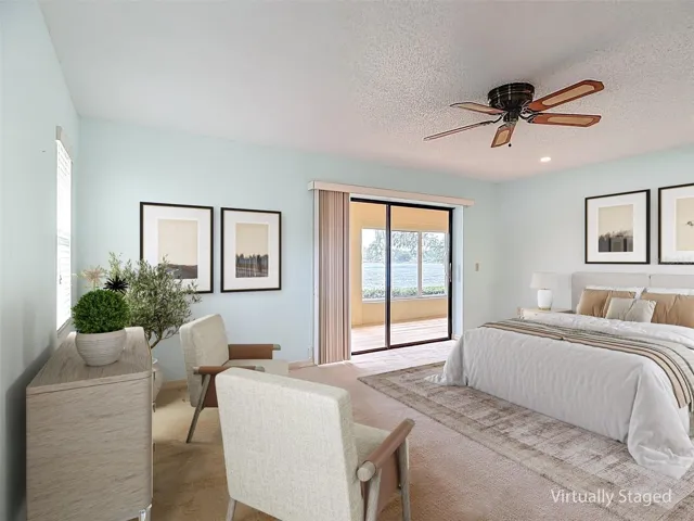 Virtual staging of 17x14 Primary bedroom with water views.