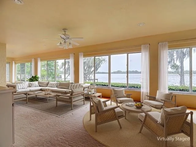 Virtual staging of large porch area overlooking Lake Pansy.