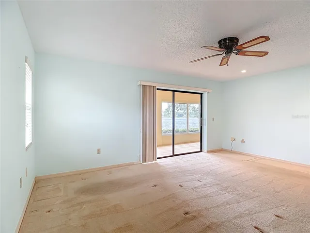 Primary bedroom 17x14 ft with 2 walk in closets and a beautiful water view.