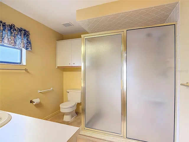 Ensuite guest bathroom with large walk-in shower.