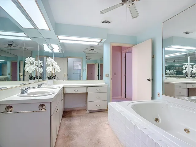 Master bath with dual sinks and lots of mirrors.