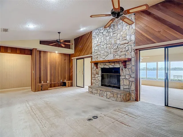 29 x 15 ft living room with vaulted ceilings and fans.