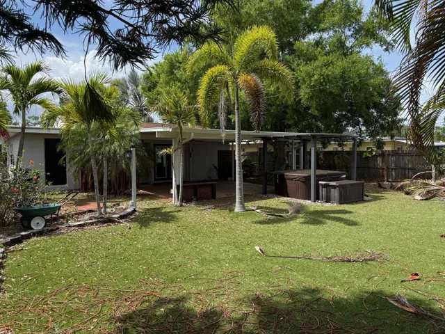 Backyard with Artificial Turf and Large Covered Patio