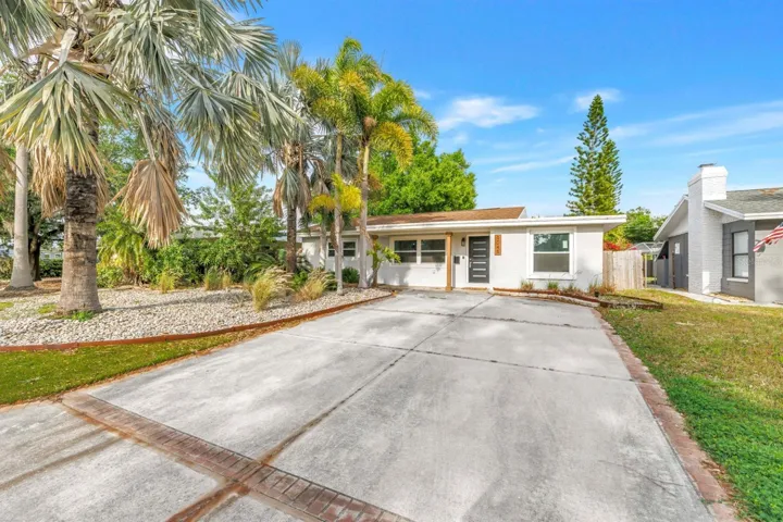 Large Driveway, Artificial Turf and Mature Landscape