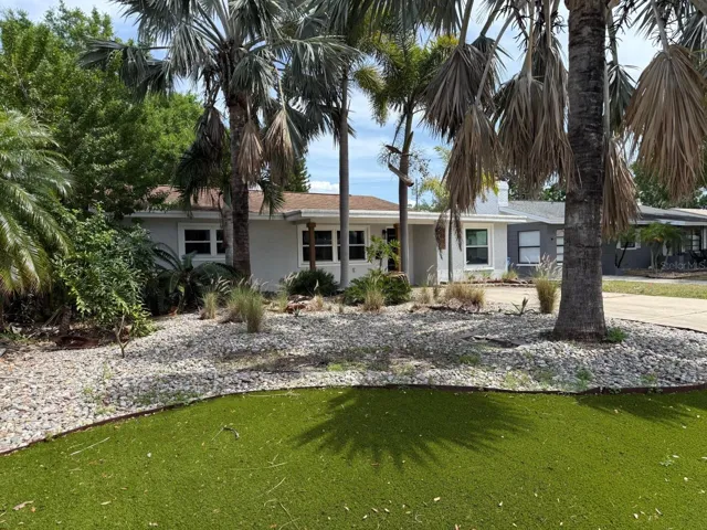 Front Yard with Artificial Turf and Mature Landscape