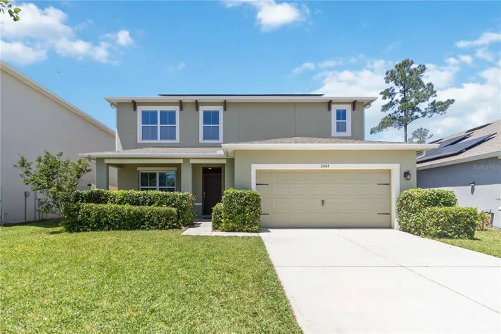 Solar Panels, oversize garage, covered porch, neighborhood sidewalks
