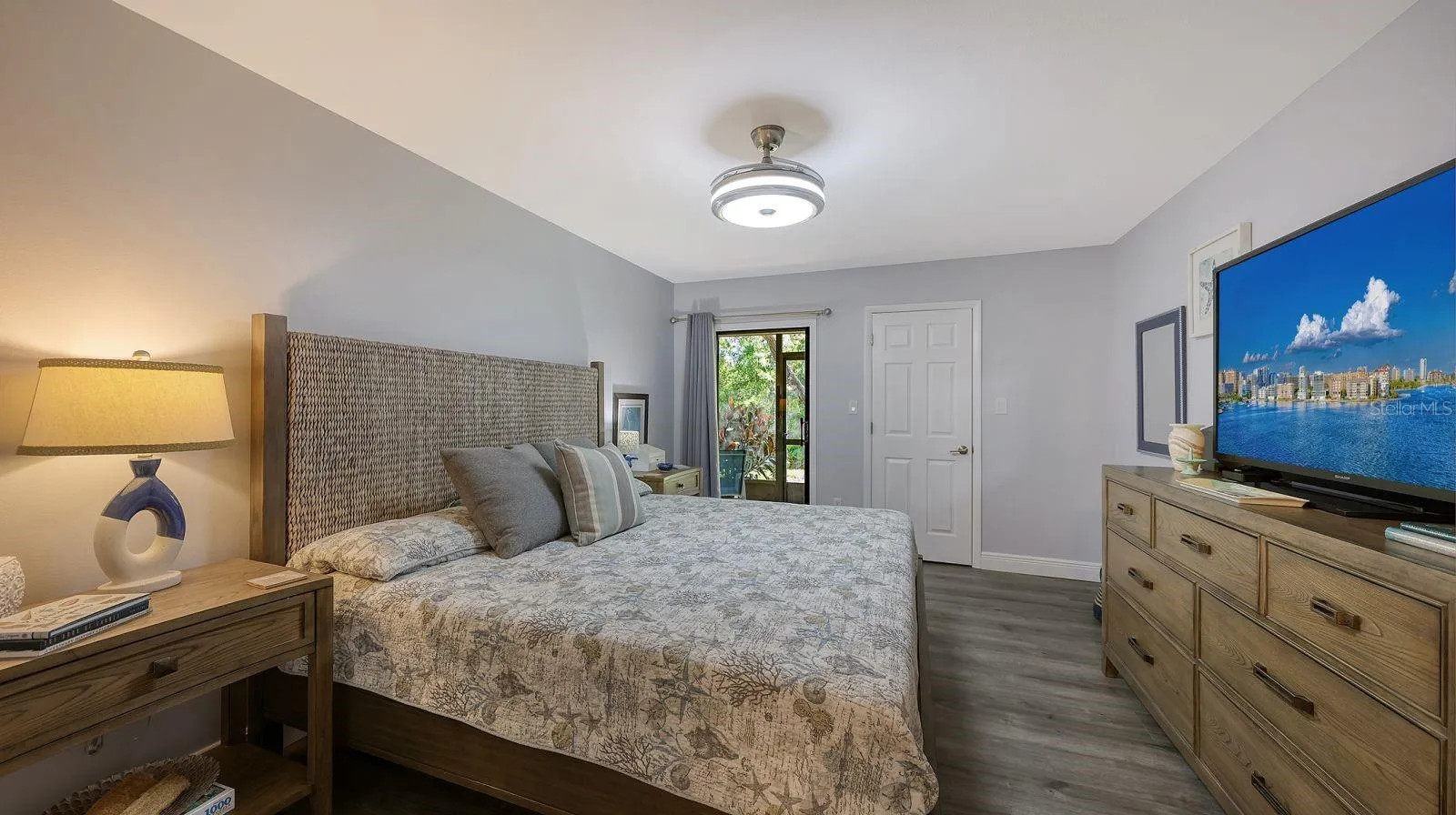 Primary Bedroom Suite with a Large Walk-in-Closet and Slider to the Lanai