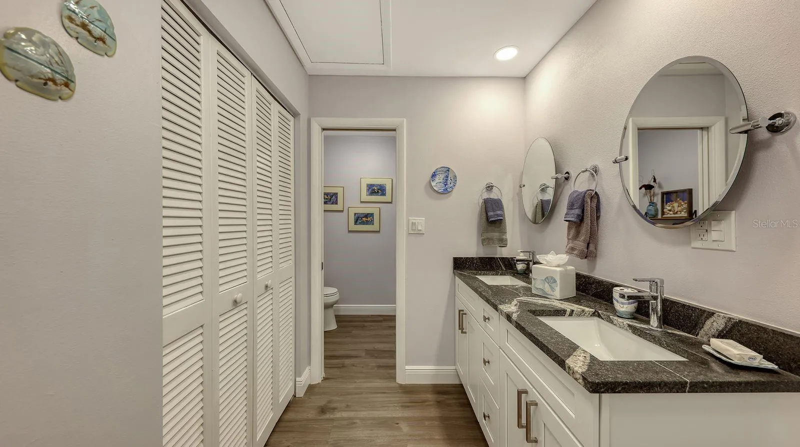 Primary Bathroom with Newer Dual Sink Vanities (Solid Wood and Granite Tops)