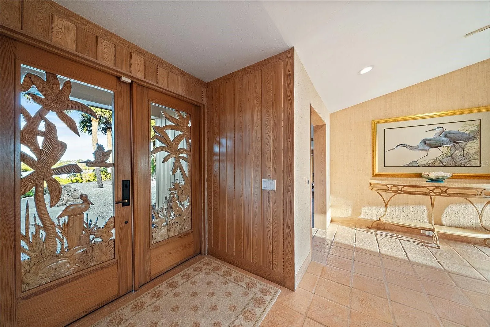 Really pretty front door, for both form and function bringing in that natural sunrise glow in an artistic way!