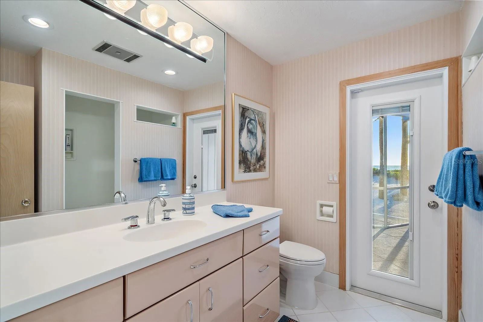 JACK AND JILL shared full bathroom (by the two bedrooms), WALK out to the pool/beach