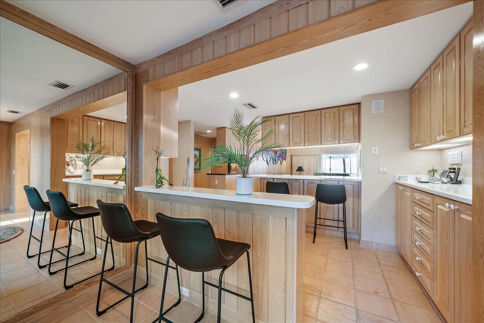 KITCHEN - this is the area I'm talking about... behind the chairs is even more room to curate the space - could be a secondary breakfast or cocktail room - wine room??