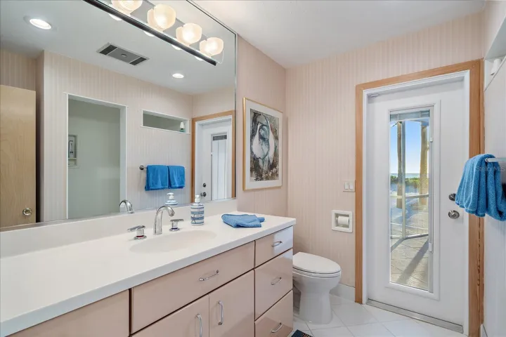 JACK AND JILL shared full bathroom (by the two bedrooms), WALK out to the pool/beach