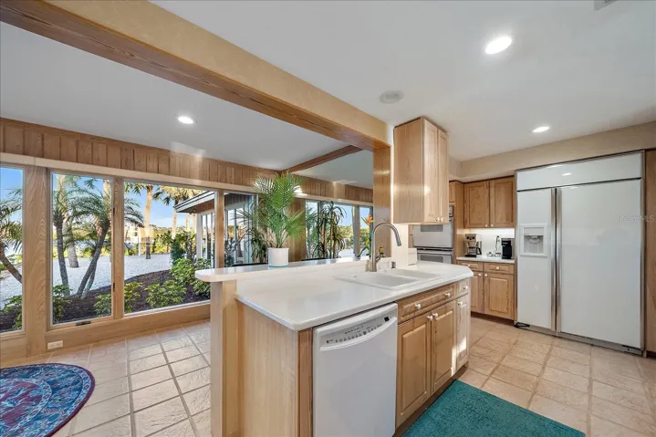 KITCHEN - notice the extra seating space by the windows!  Full length mirror, room for imagination here!