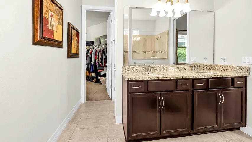 Master bath leading to large walk in closet
