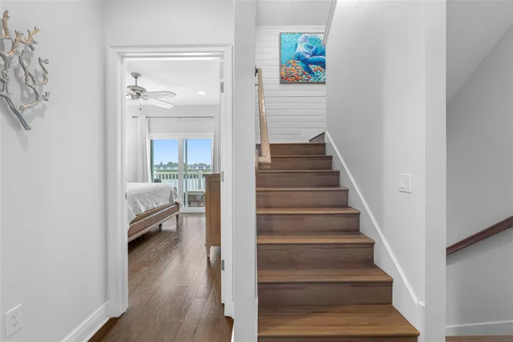 ... 3rd Floor Landing.. Waterfront Master Suite Ahead.. New Softer Wood Floors - New Wall Finish Thru Out Home. Stairs to 4th Level Upper Floor.
