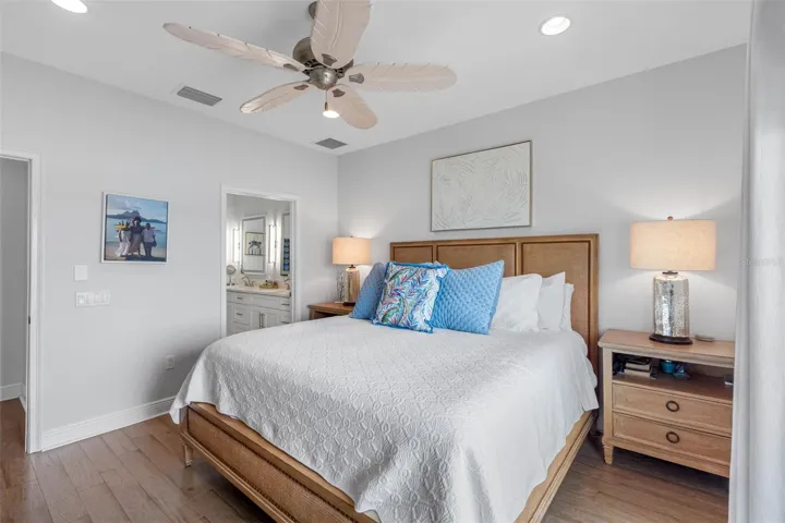 .. Master Suite Lookign In from Balcony Aera. Master Bath Thru Open Door.. Wood Floors on 3rd and 4th Levels. A little easier on the feet. Main Floor of Living has Porcelain Plank Tiling.