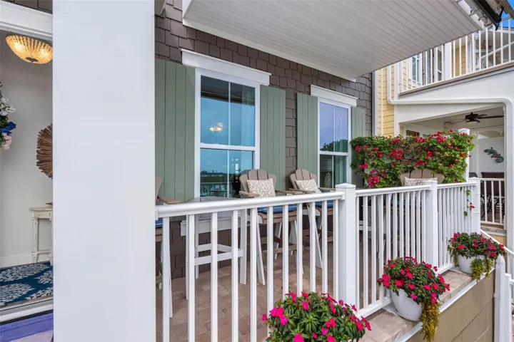 ... All 3 Living Floors Have A Waterfront Balcony.. Townhome Shows impeccable. Photo of Main Floor #2.. Garage is Floor #1.. This Balcony is Off The Living Room . Owners had a Retractable Awning Installed For Comfort When Needed.