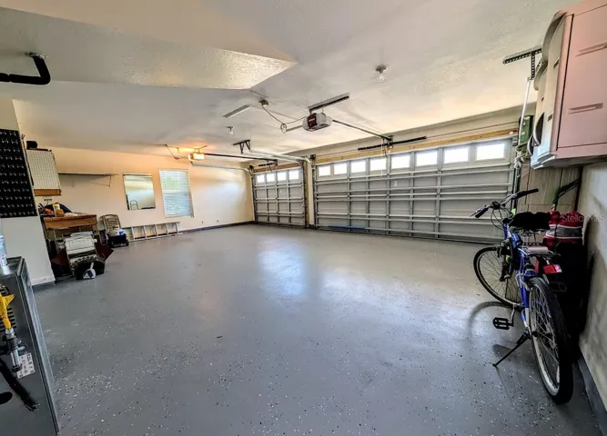 Oversized 3 car garage with access to attic space