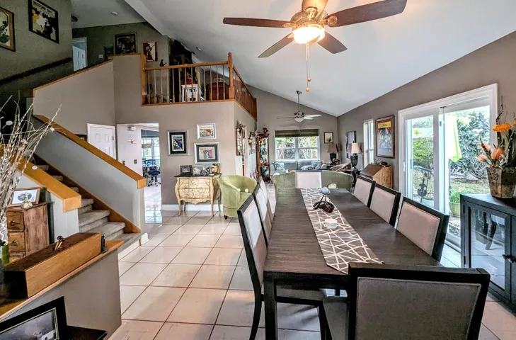 Living / dining with stairs to loft and bed/bath area