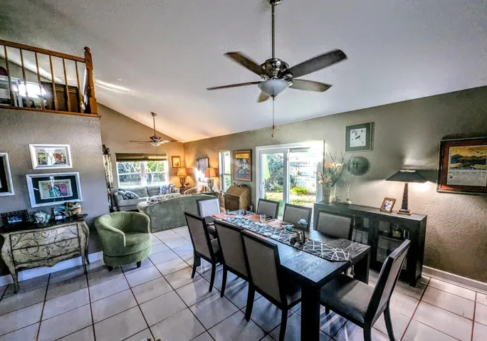 View of living / dining and sliders to patio