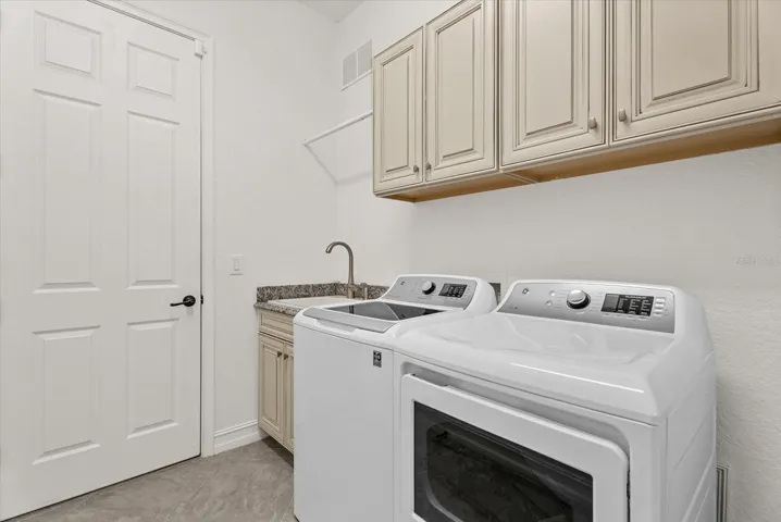 Laundry Room with built- ins and sink