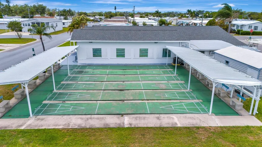 Aeriel view of shuffle boards and clubhouse.