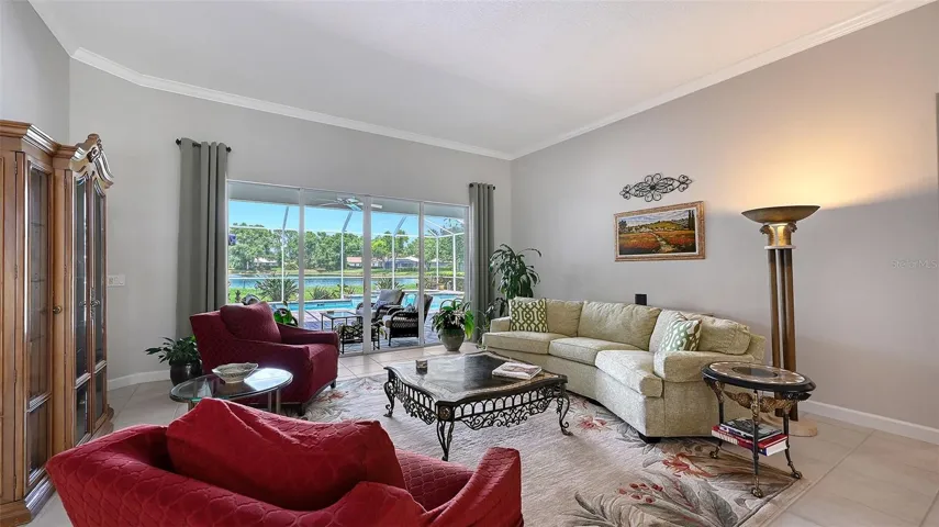 Living room with draped windows.