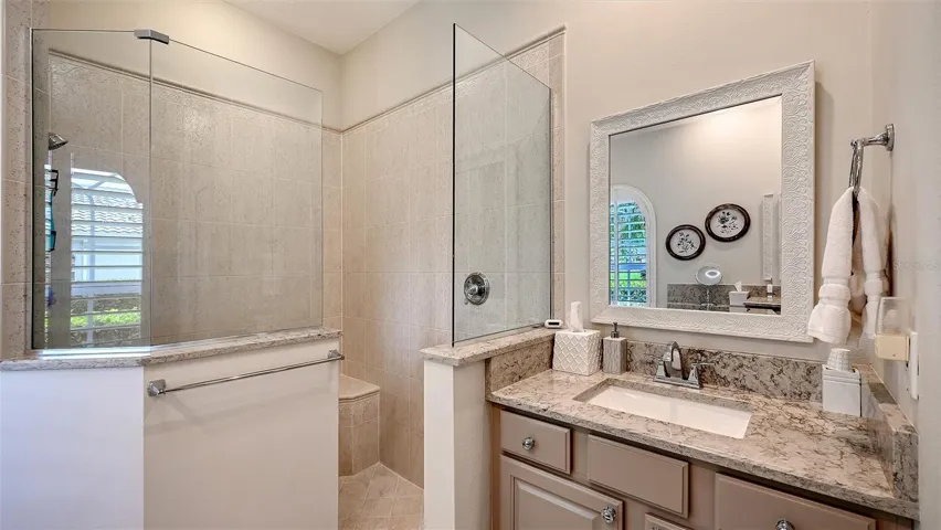 Primary Bath, dual vanities, walk in shower, corner tub.