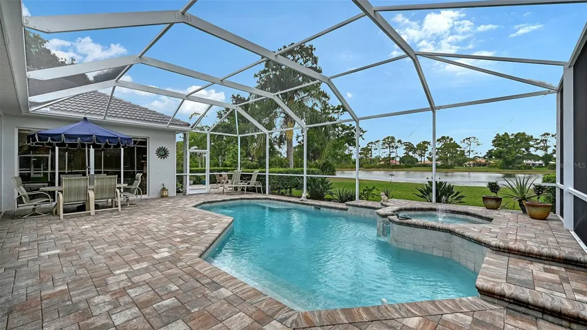 Patio and pool looking toward firepit area.