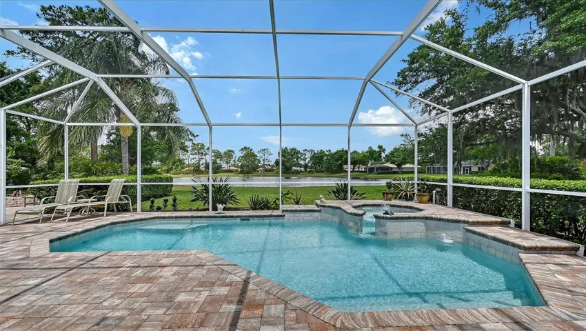 Pool and spa overlooking lake.