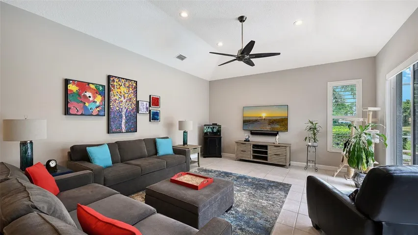 Family room with single-step tray ceiling with a vaulted feel.