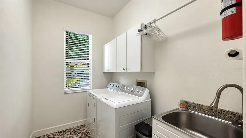 Laundry room with built-in sink.