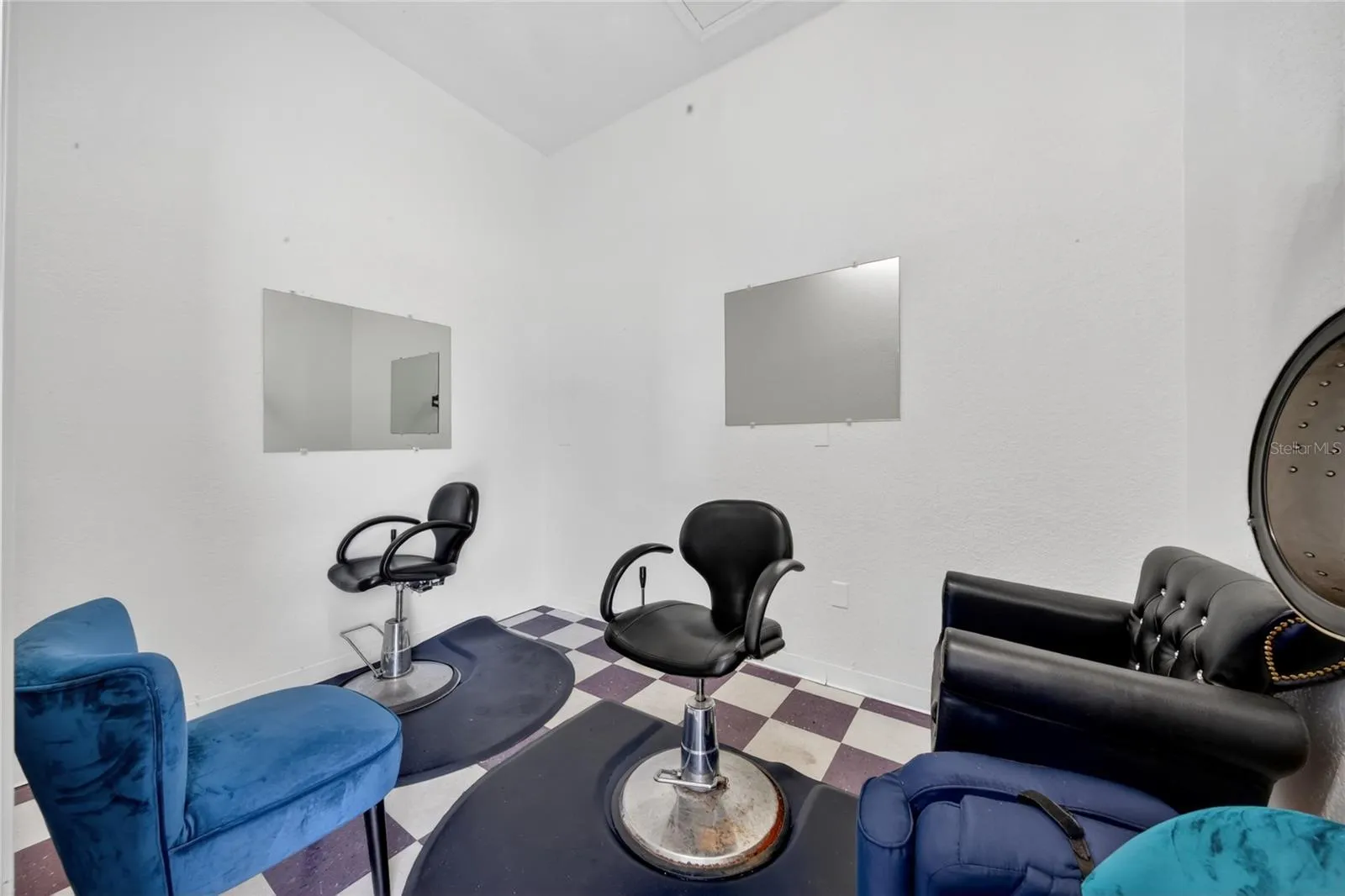 Room with two barber chairs