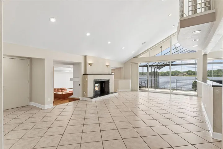 Living Room with fireplace overlooking the formal dining room / great room.