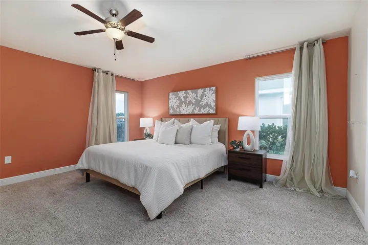 Spacious primary with  ceiling fan &amp; 2 windows for fabulous light