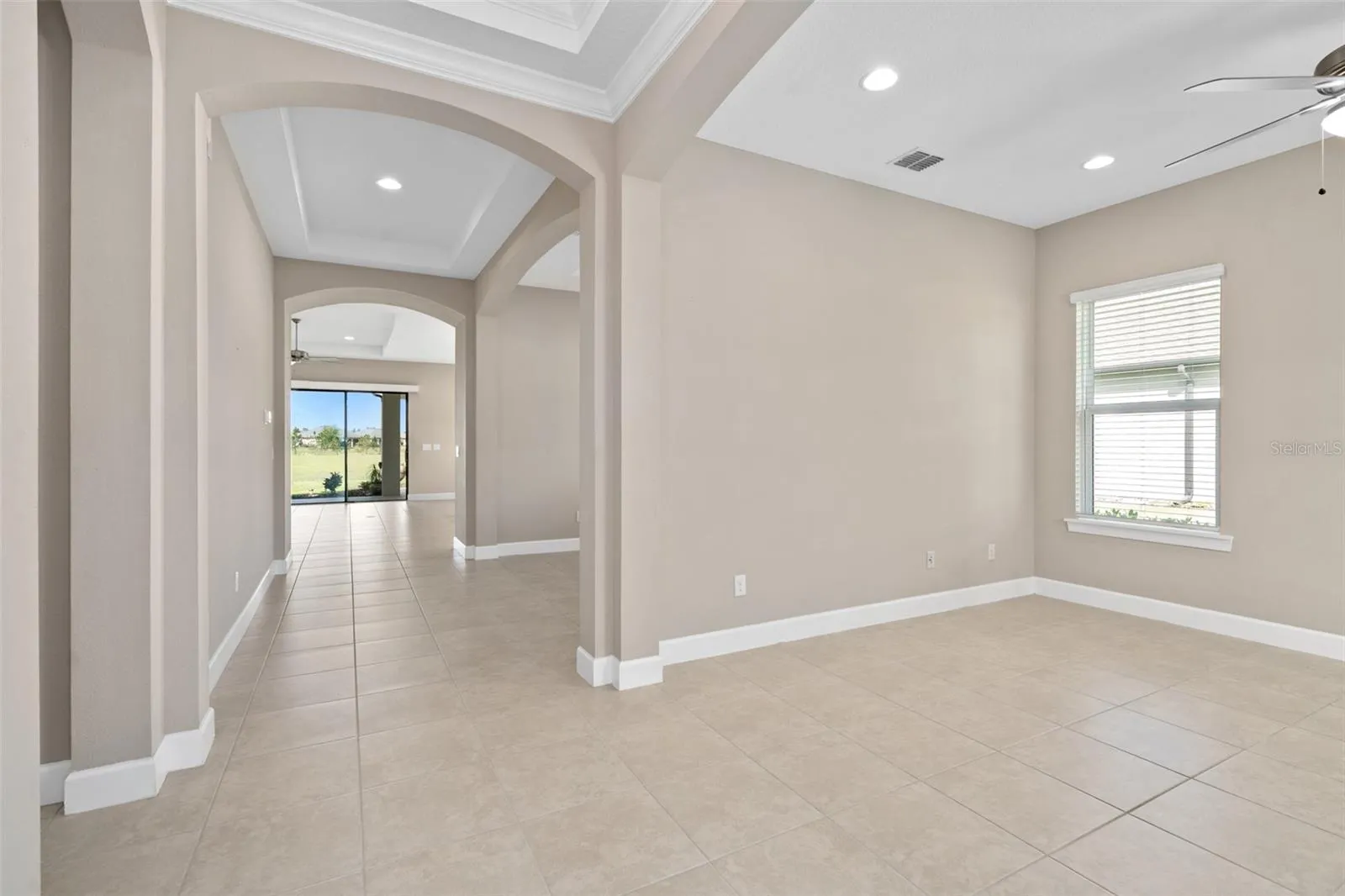 A View from the Flex Space toward the Foyer. This home has 10' Ceilings throughout plus Trays
