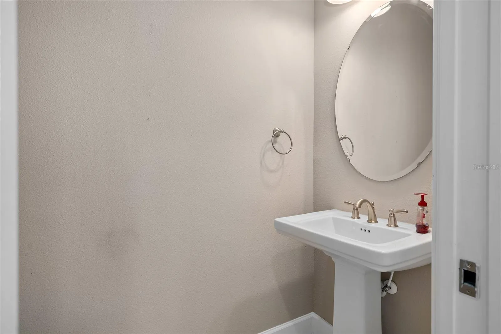 The Powder Room is adjacent to the Laundry Room