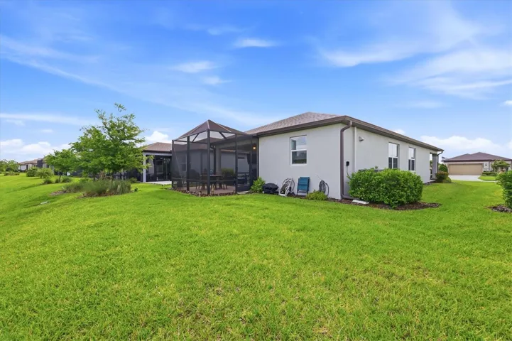 Rear of home offers extra space to add a pool or further extend the lanai