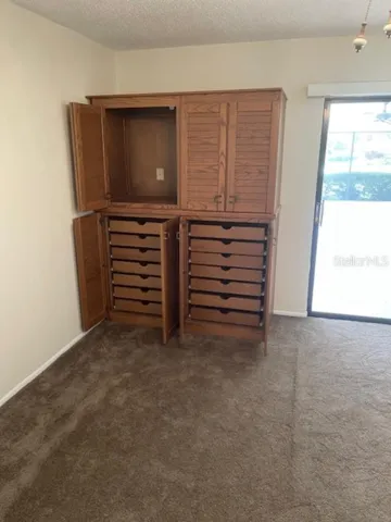 Primary Bedroom with slider to poop